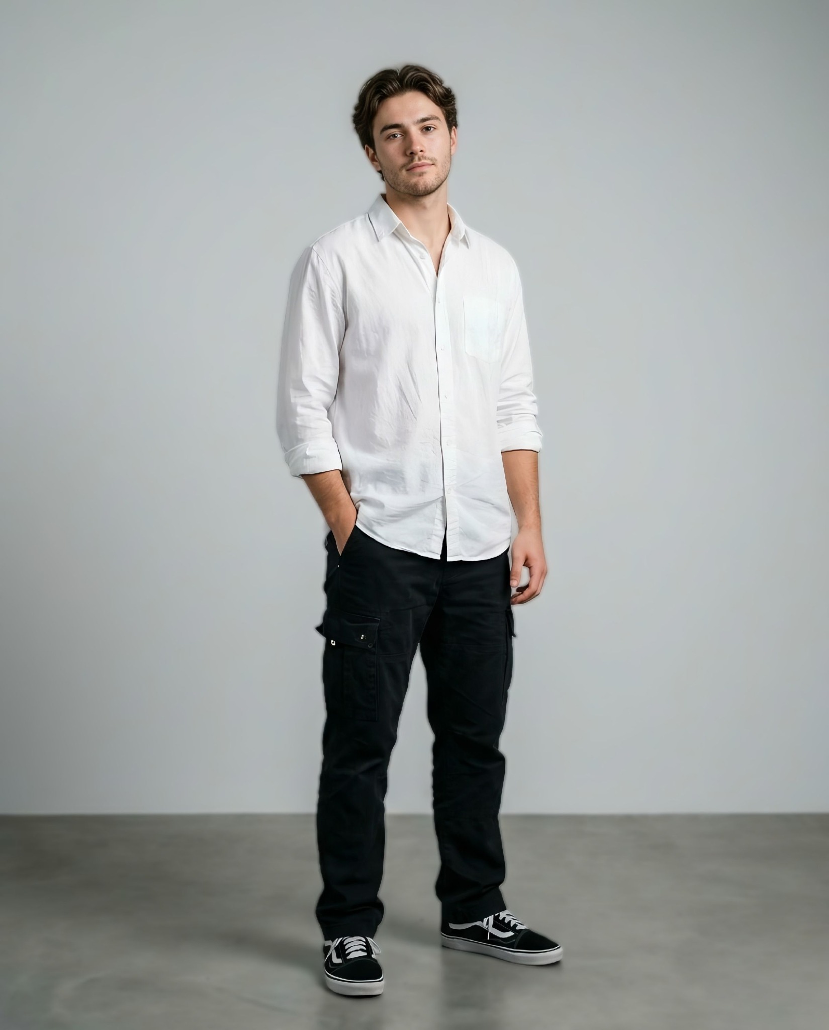 Ultra-realistic full-body portrait of a young man standing relaxed against a plain light grey backgr