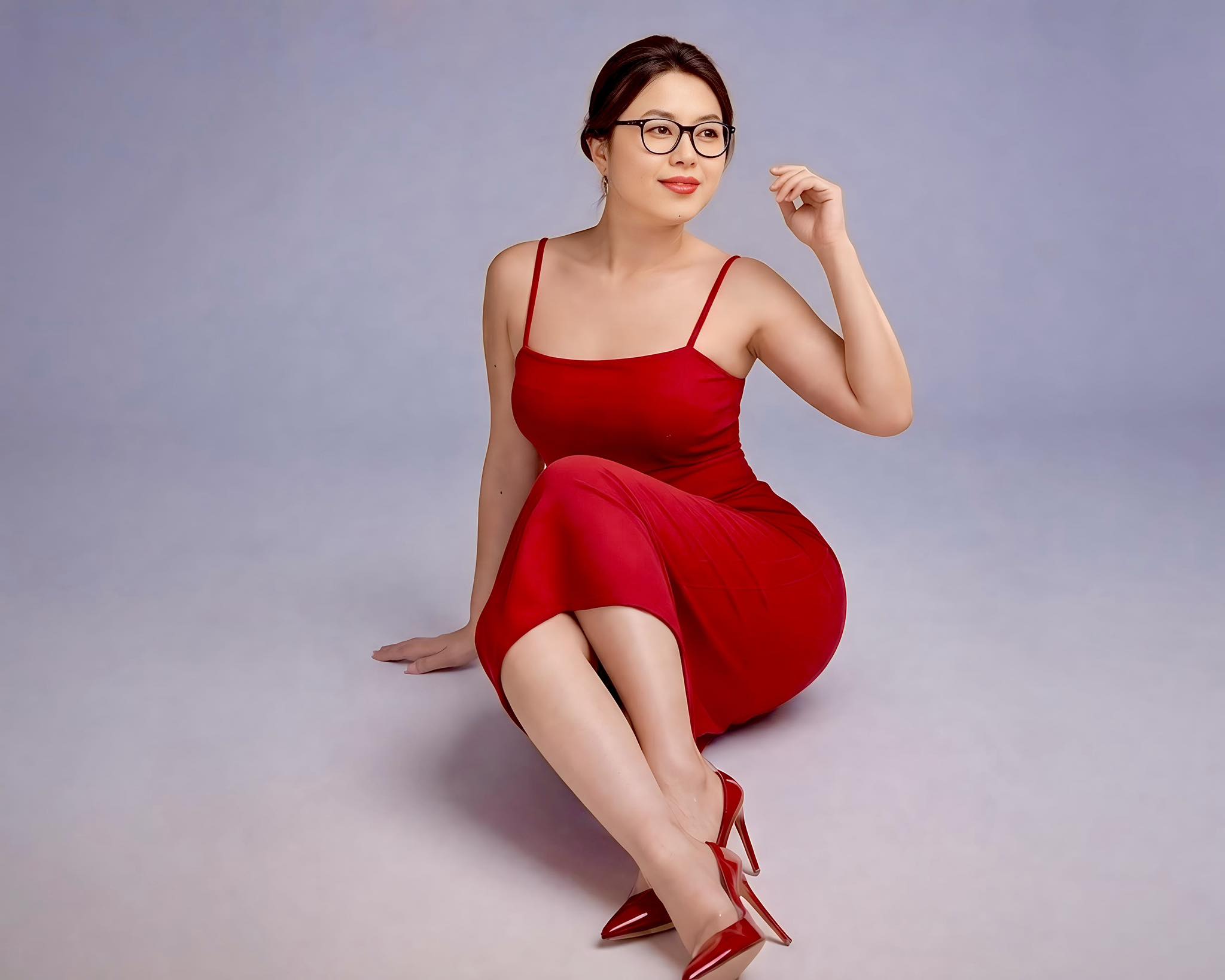 Use the uploaded photo of my wife as the only identity reference. Preserve her face, glasses, hairst