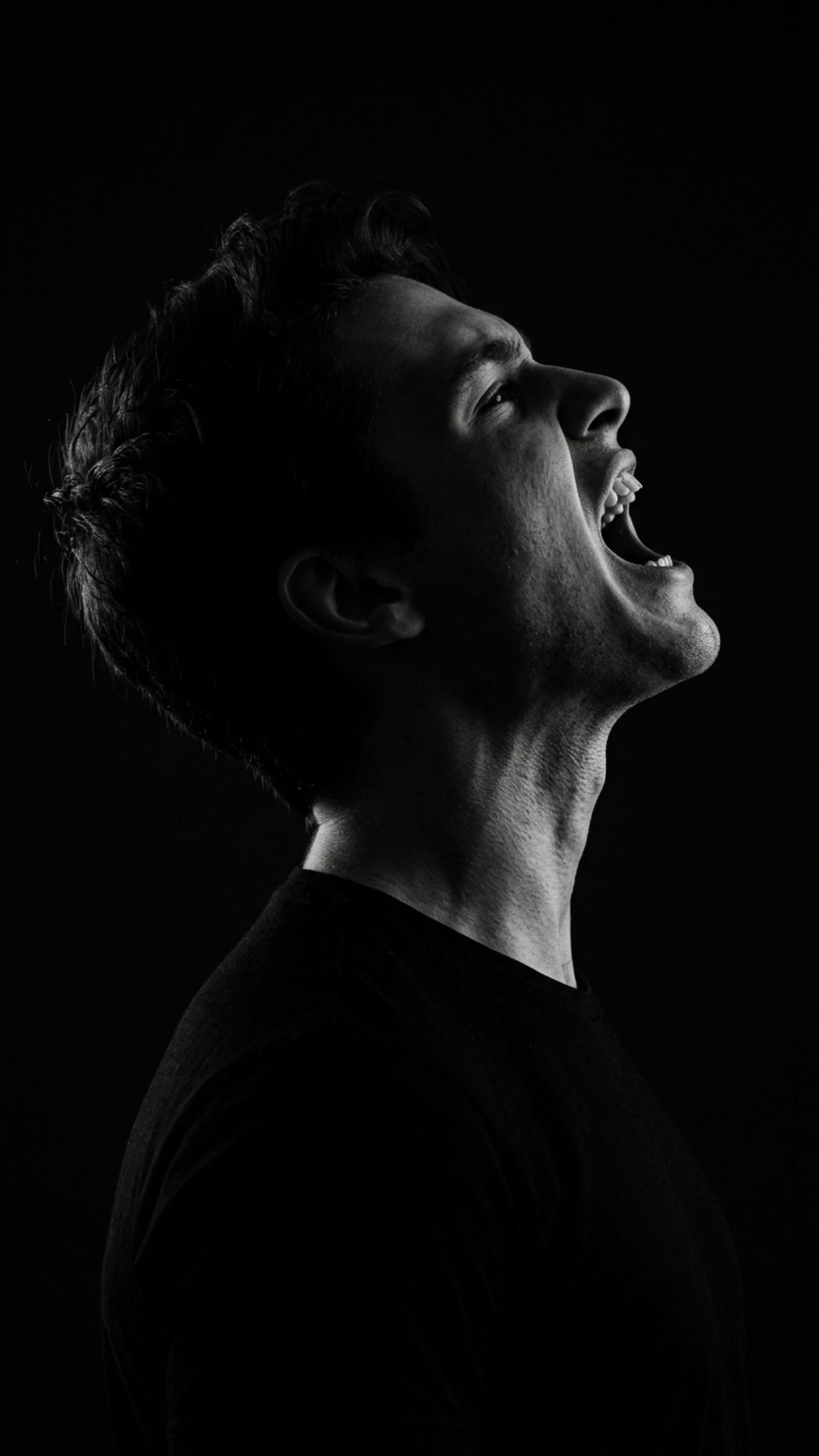 Ultra-realistic 8K cinematic black-and-white side profile portrait of a young man, STRICT pose: head