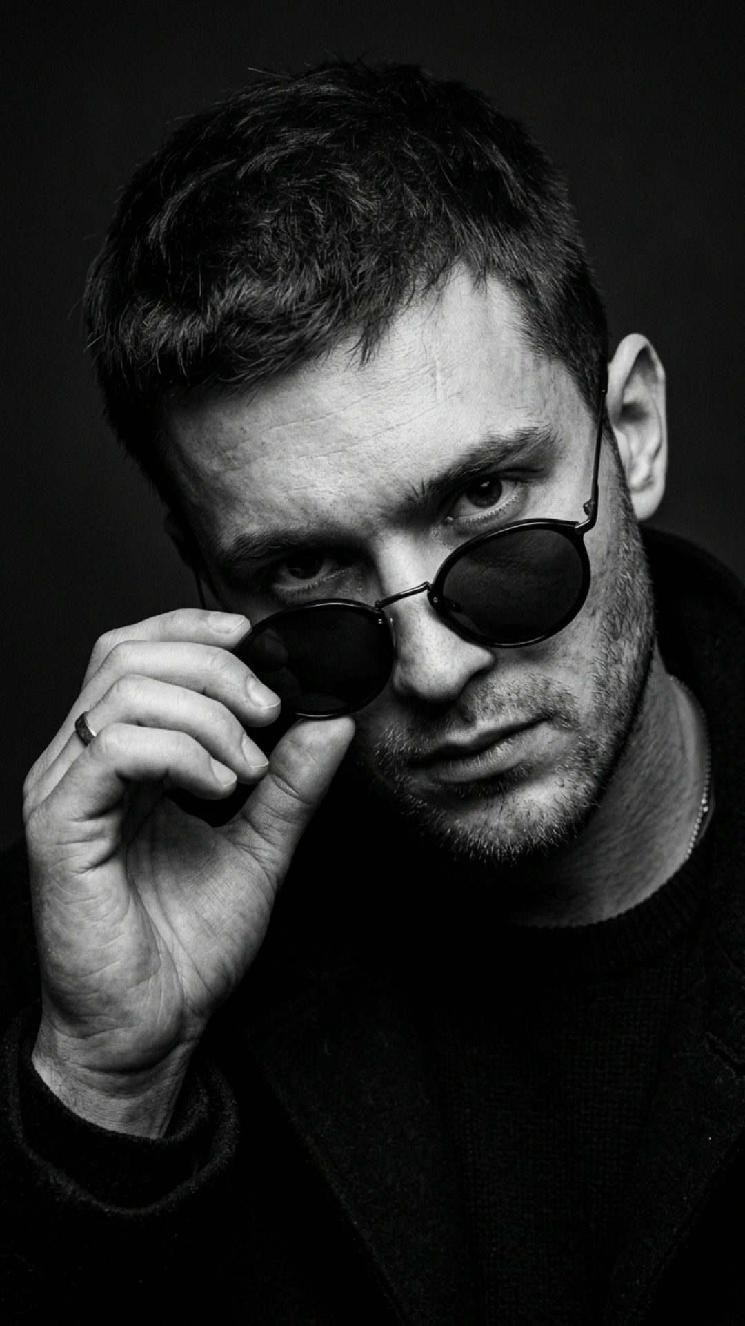 Ultra-realistic 8K cinematic black-and-white close-up portrait of a young man, STRICT pose: head sli