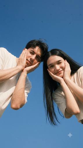 Create image: A young Asian couple [attached references] in their twenties, both — DALL-E AI Prompt