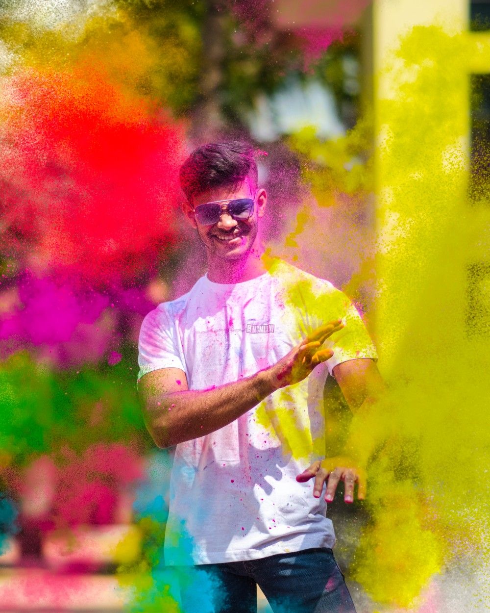 TASK: Recreate this exact Holi image but with the person from the REFERENCE IMAG — Google Gemini AI Image Prompt