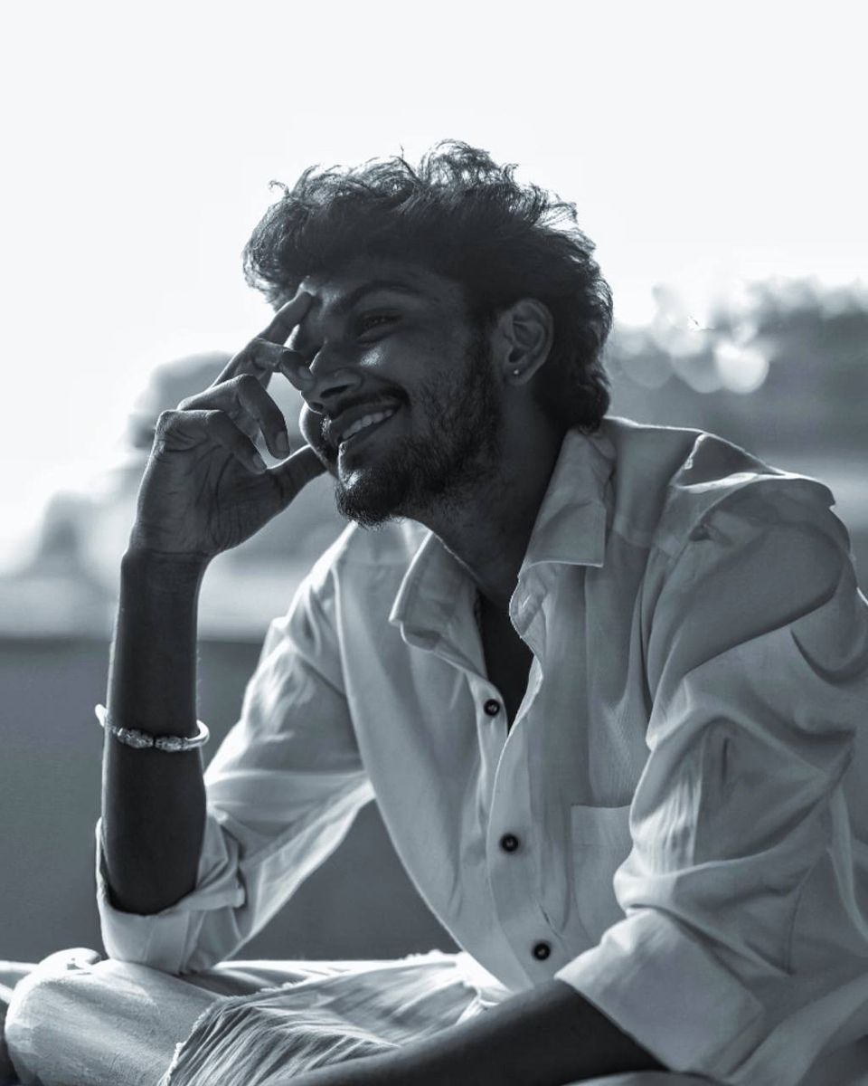 black and white candid portrait of [SUBJECT - e.g., a young man with curly volum — DALL-E AI Image Prompt