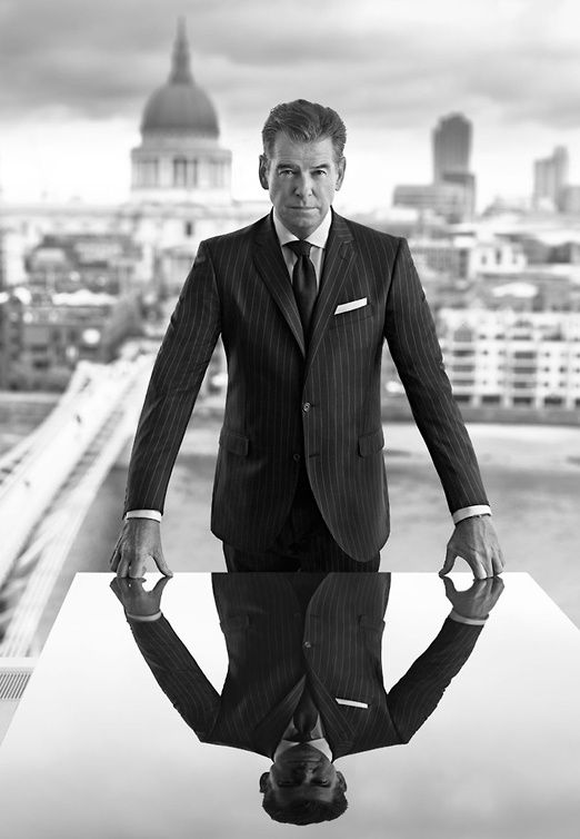 Photorealistic black and white portrait of a man in a sharp pinstripe suit stand — DALL-E AI Image Prompt