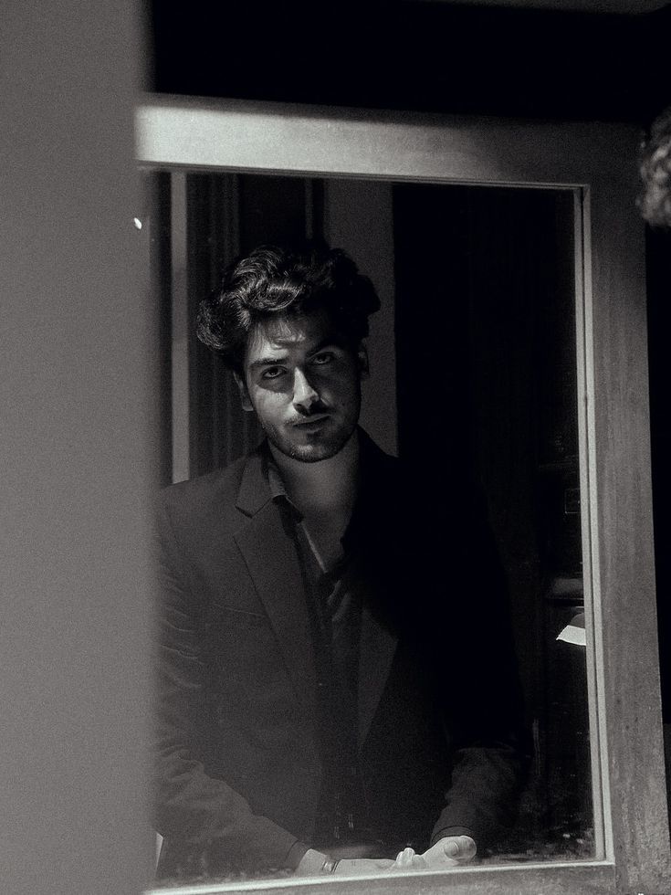 black and white cinematic window reflection portrait of [SUBJECT: young handsome — DALL-E AI Prompt