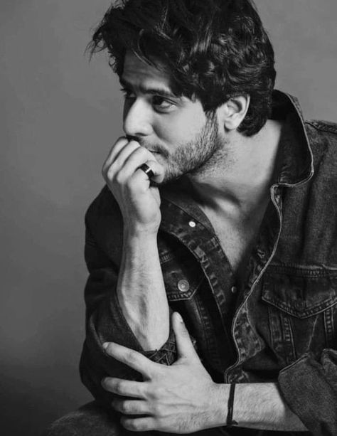 black and white moody editorial portrait of [SUBJECT: young handsome man mid 20s — DALL-E AI Prompt