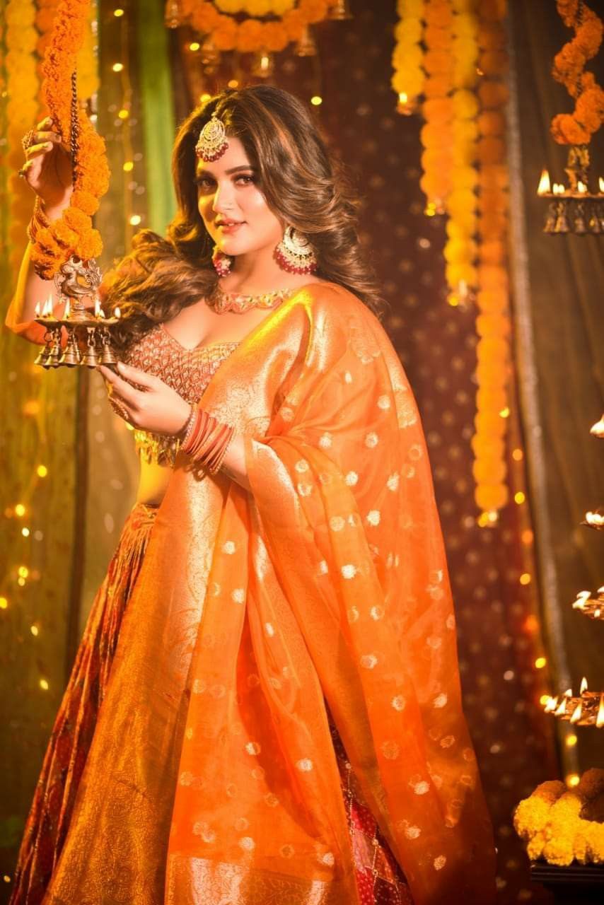 cinematic royal Diwali hanging Ganesh diya orange lehenga portrait of [SUBJECT:  — DALL-E AI Image Prompt