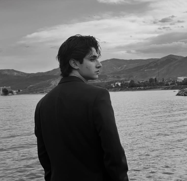 black and white cinematic portrait of [SUBJECT - e.g., a young man with medium l — DALL-E AI Prompt