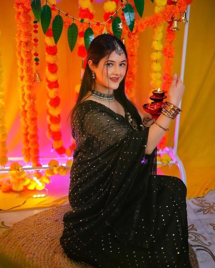 cinematic full kneeling Diwali diya tower black saree portrait of [SUBJECT: beau — DALL-E AI Image Prompt
