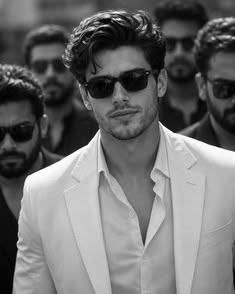 Photorealistic black and white cinematic portrait of a stylish man leading a gro — DALL-E AI Image Prompt