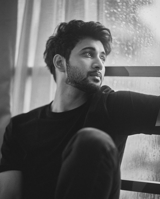 black and white rainy window pensive portrait of [SUBJECT: young handsome man mi — DALL-E AI Prompt
